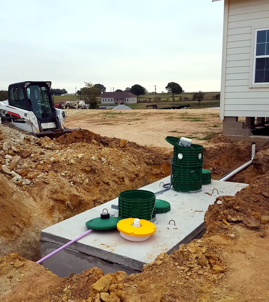 New aerobic septic system beside a new home