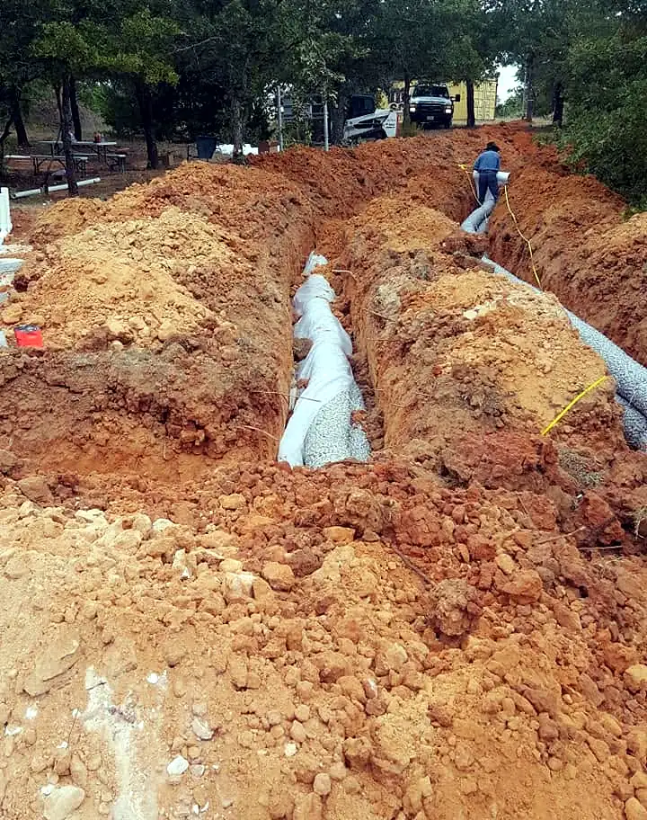 Perforated lateral line pipe in a fresh trench
