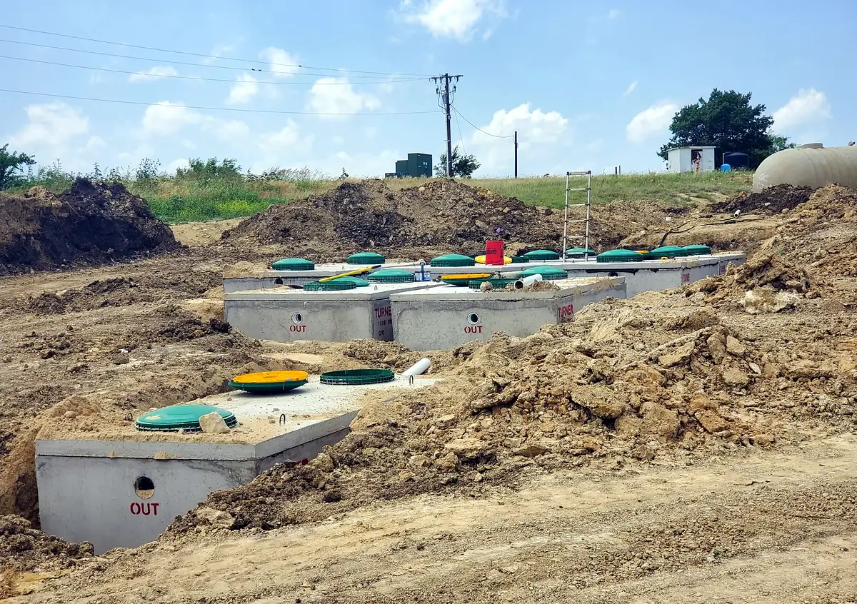 New septic tanks set on a job site — LenRoyDon Builders serves Johnson County, Texas