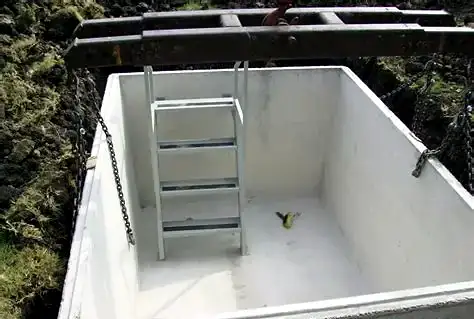 Inside a Hausner concrete storm shelter with steel ladder